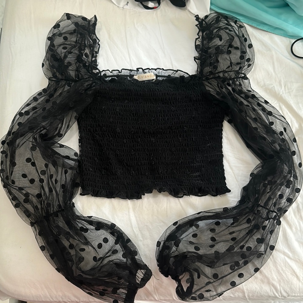 Long sleeve smocked polka dot top